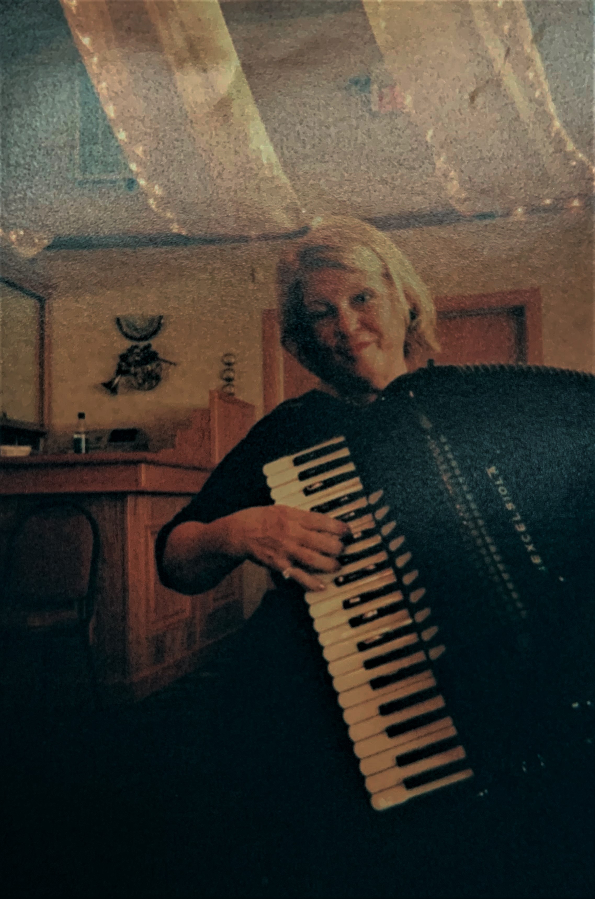 Heather playing accordion.